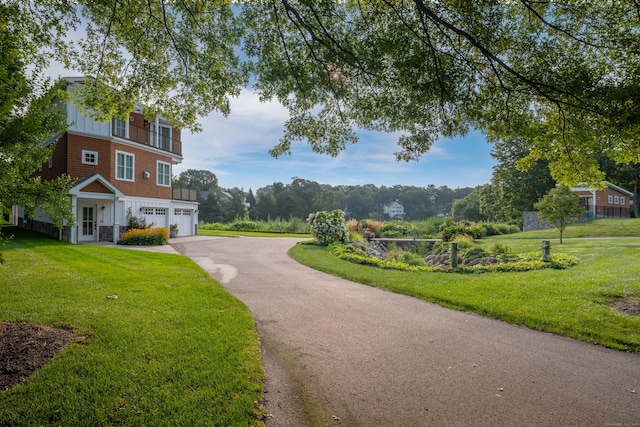 view of property's community with a lawn