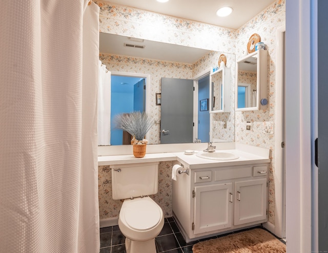 bathroom featuring tile patterned flooring, vanity, curtained shower, and toilet