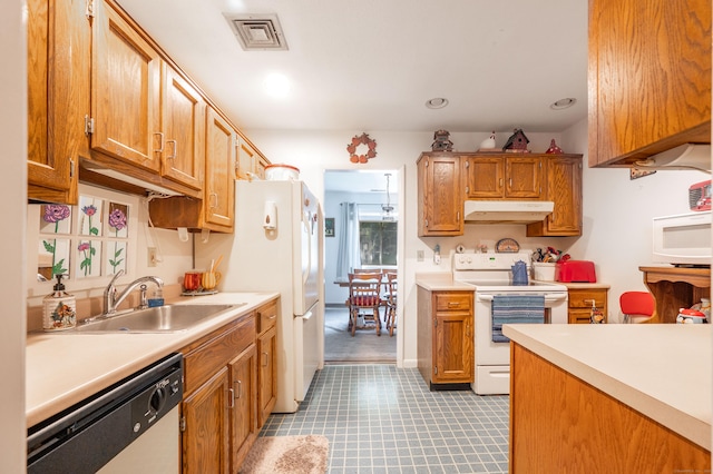 kitchen featuring sink and white appliances