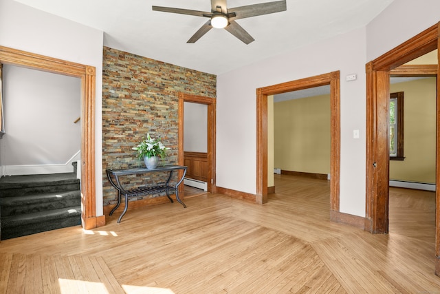 hall featuring baseboard heating and light hardwood / wood-style floors