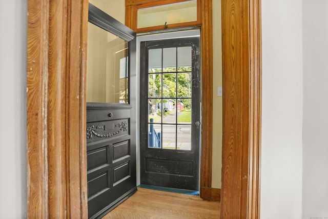 doorway to outside with light wood-type flooring