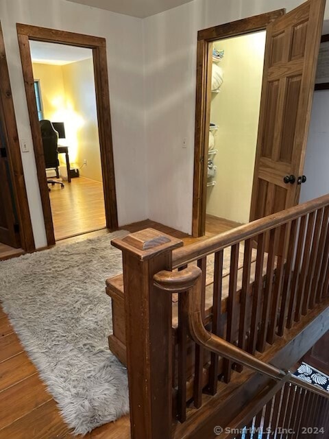 stairway featuring hardwood / wood-style flooring