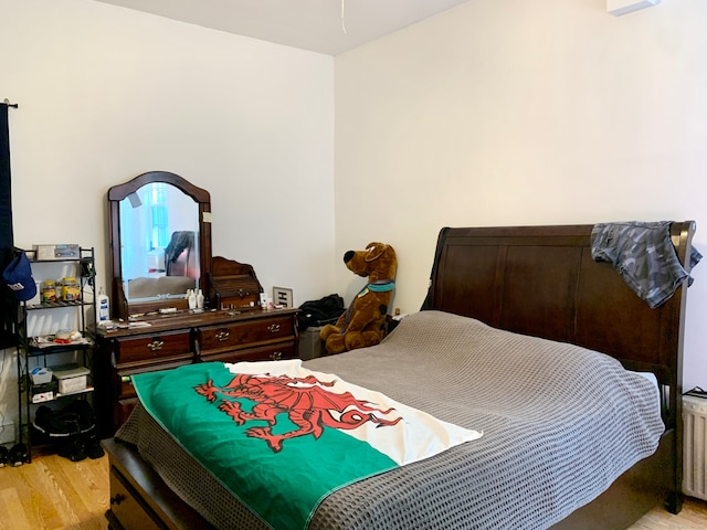 bedroom with light hardwood / wood-style flooring