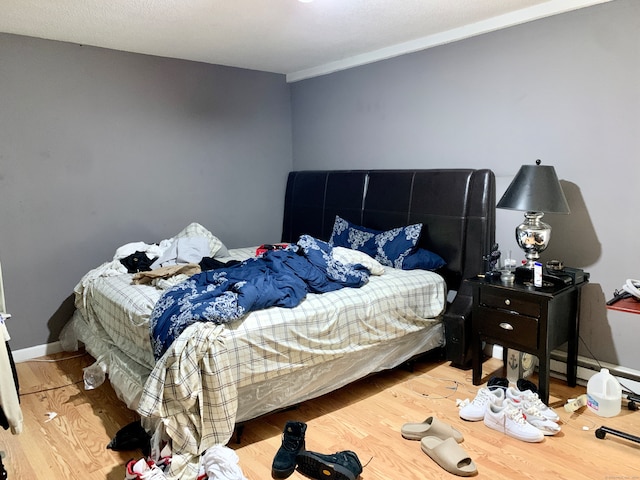 bedroom with light hardwood / wood-style flooring