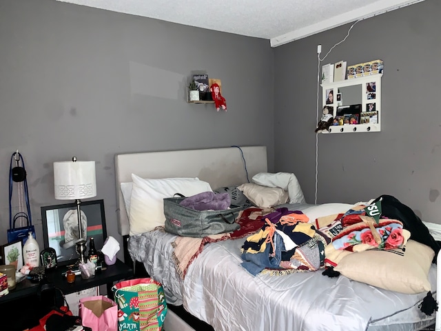 bedroom featuring a textured ceiling