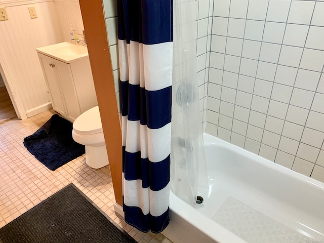 full bathroom featuring vanity, toilet, tile patterned flooring, and shower / bath combination with curtain