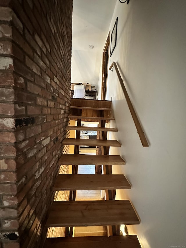 130 Valley Rd, North Branford, CT 06471 - stairway featuring brick wall