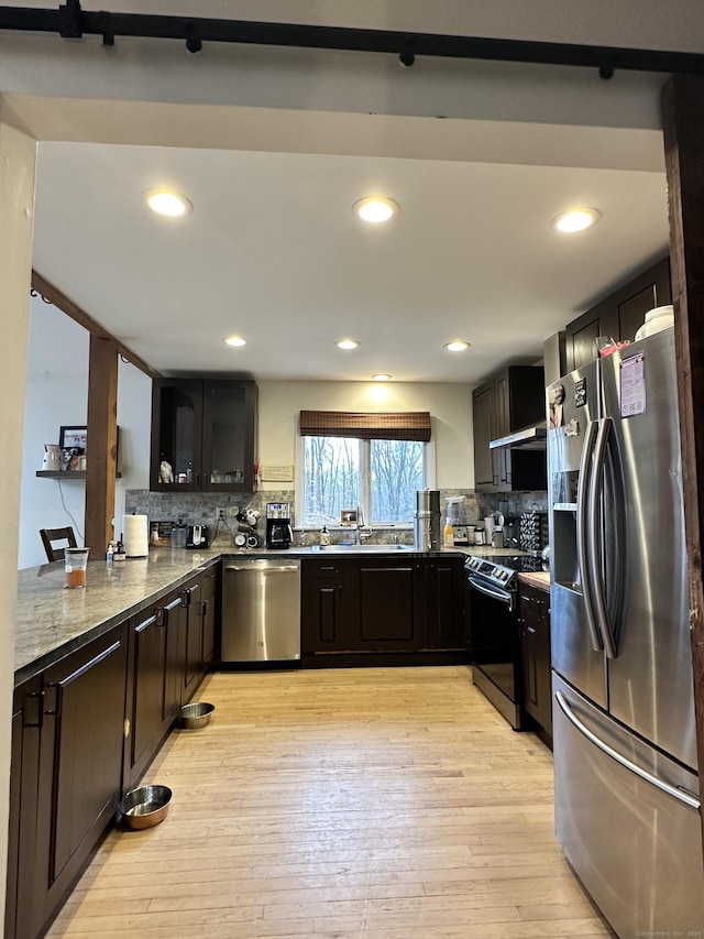 130 Valley Rd, North Branford, CT 06471 - kitchen featuring decorative backsplash, light wood finished floors, a sink, and stainless steel appliances