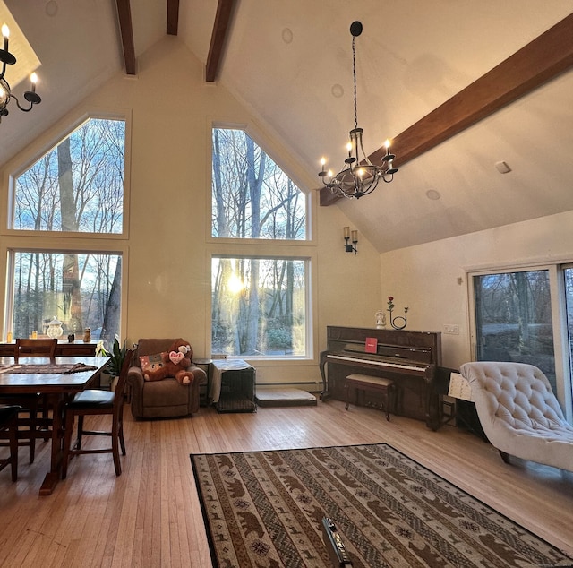 130 Valley Rd, North Branford, CT 06471 - living area with beam ceiling, high vaulted ceiling, light wood finished floors, and an inviting chandelier