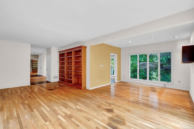 unfurnished living room featuring light hardwood / wood-style floors