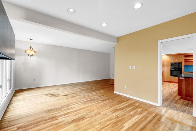 unfurnished room with light hardwood / wood-style flooring