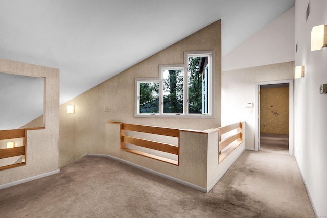 additional living space with lofted ceiling and light colored carpet