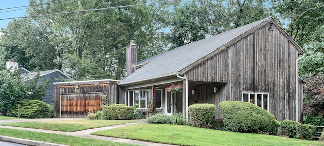 view of front of house with a porch and a front lawn