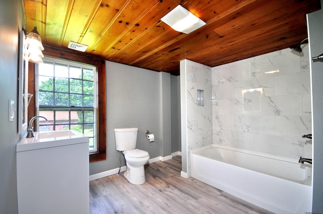 full bathroom with toilet, wood-type flooring, wooden ceiling, vanity, and tiled shower / bath combo