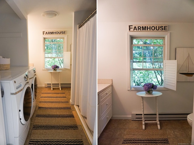 washroom featuring washer and clothes dryer, dark tile patterned flooring, and a baseboard radiator