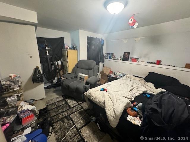 bedroom featuring lofted ceiling