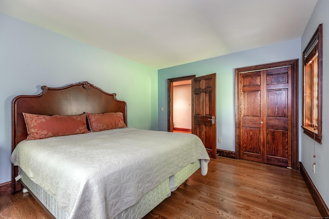 bedroom with wood-type flooring