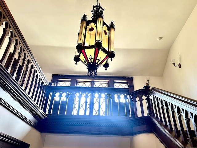 staircase with lofted ceiling