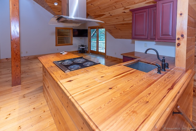 kitchen with sink, vaulted ceiling, light hardwood / wood-style floors, and wood ceiling