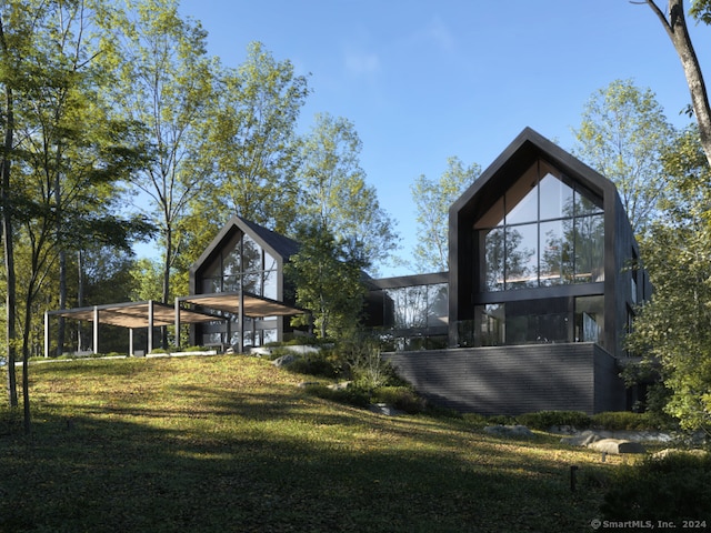 rear view of house with a lawn