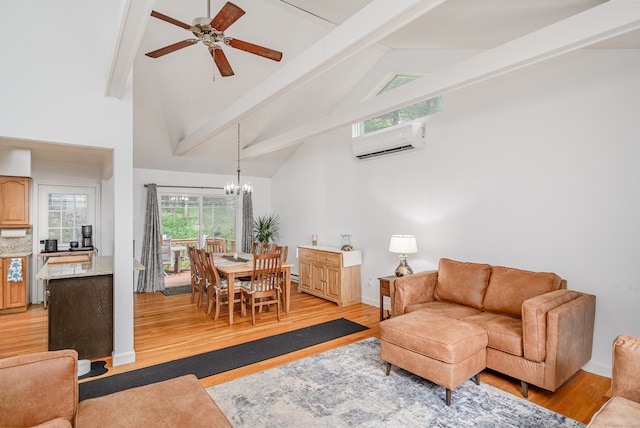 living room with a wall unit AC, beamed ceiling, light hardwood / wood-style floors, ceiling fan with notable chandelier, and high vaulted ceiling