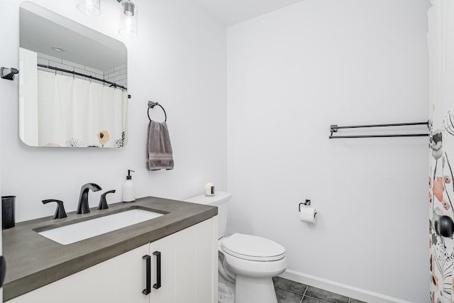 bathroom featuring vanity, toilet, and tile patterned floors