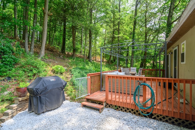 view of patio with a deck and a grill