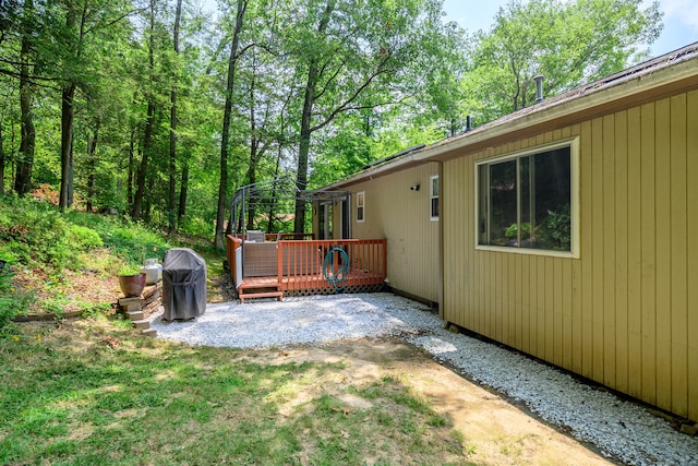 view of yard featuring a wooden deck