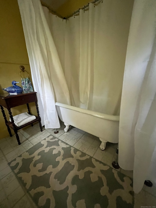 bathroom featuring a tub and tile patterned floors