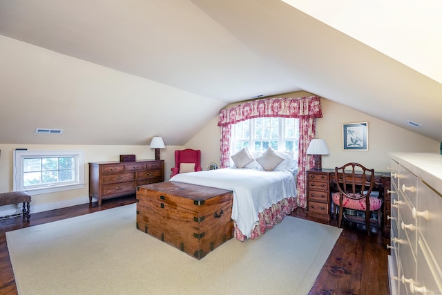 bedroom featuring lofted ceiling and dark hardwood / wood-style floors