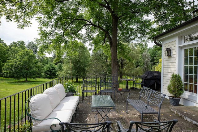 view of patio featuring area for grilling and an outdoor hangout area