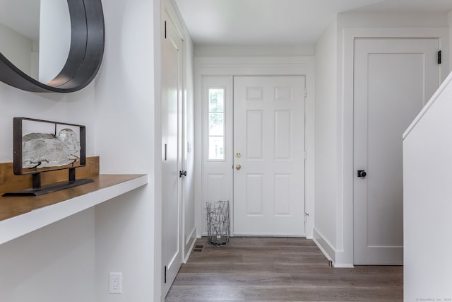 entryway with hardwood / wood-style flooring