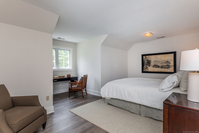 bedroom featuring dark hardwood / wood-style flooring