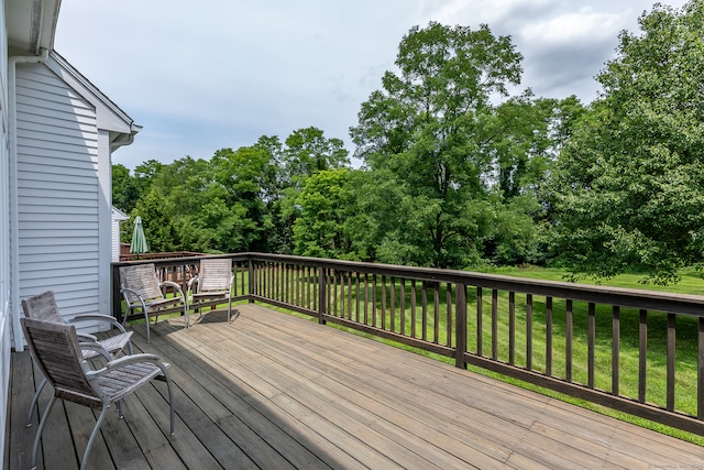 deck featuring a lawn