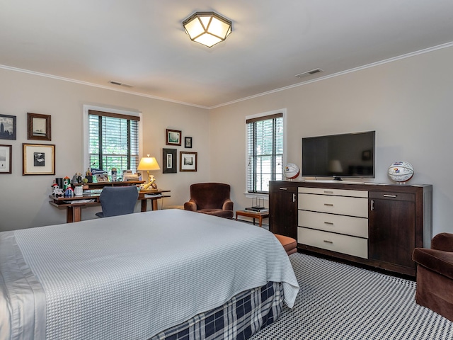 carpeted bedroom featuring visible vents and crown molding