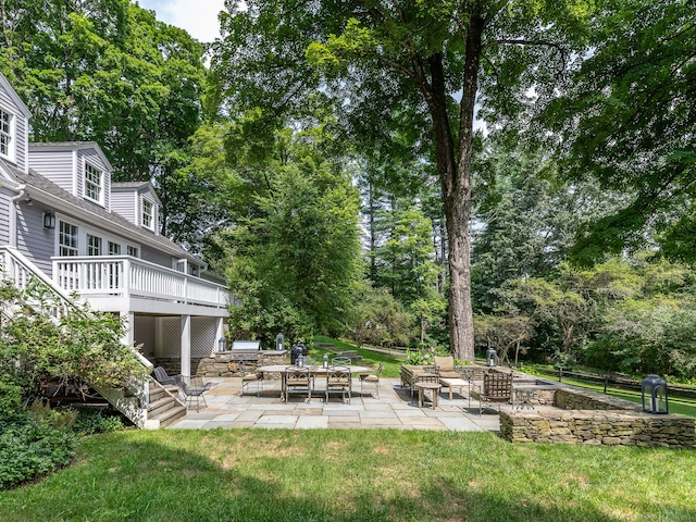 view of yard with an outdoor fire pit, stairway, a patio area, and a wooden deck