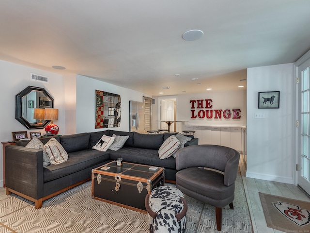 living room with recessed lighting and visible vents