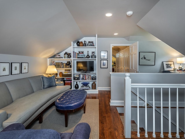 living room featuring lofted ceiling, dark wood-type flooring, and recessed lighting