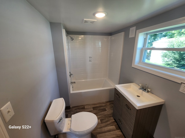 full bathroom featuring vanity, toilet, and tiled shower / bath combo