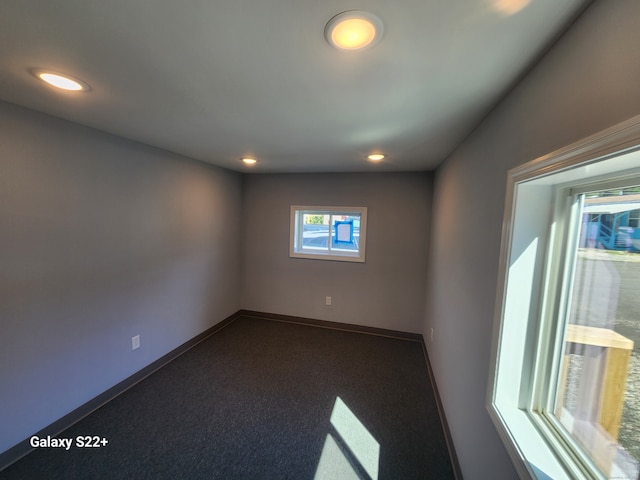 unfurnished room featuring carpet flooring