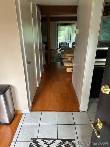 hallway featuring tile patterned floors