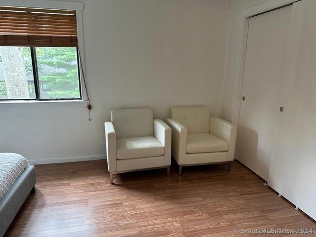 unfurnished room with wood-type flooring