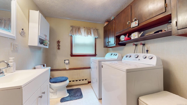 230 Unionville Ave, Plainville, CT 06062 - laundry room featuring baseboard heating, separate washer and dryer, a textured ceiling, and light flooring