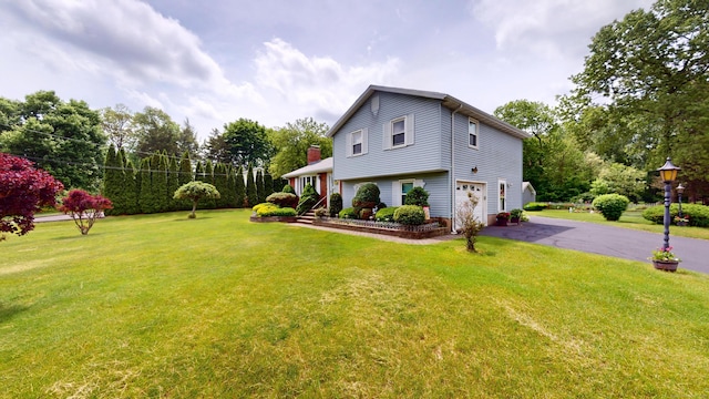 230 Unionville Ave, Plainville, CT 06062 - view of side of property with an attached garage, asphalt driveway, and a lawn