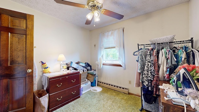 230 Unionville Ave, Plainville, CT 06062 - bedroom featuring a baseboard heating unit, a textured ceiling, baseboards, and a ceiling fan