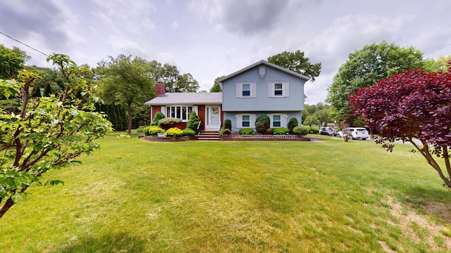 230 Unionville Ave, Plainville, CT 06062 - split level home with a front lawn and a chimney