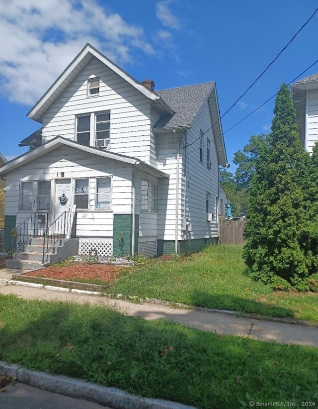 view of front of home with a front yard