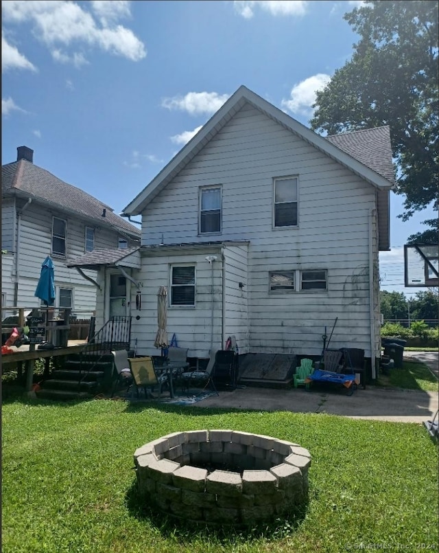 back of house with a yard