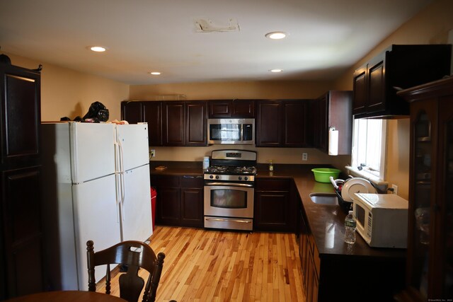 kitchen featuring sink, stainless steel appliances, and light hardwood / wood-style floors