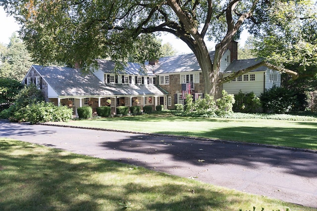114 Ferris Hill Rd, New Canaan, CT 06840 - colonial house with a chimney and a front lawn